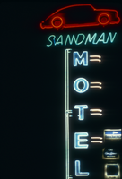 Slide of the neon sign for the Sandman Motel at night, Reno, Nevada, 1986