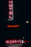 Slide of the neon sign for the Morris Hotel at night, Reno, Nevada, 1986