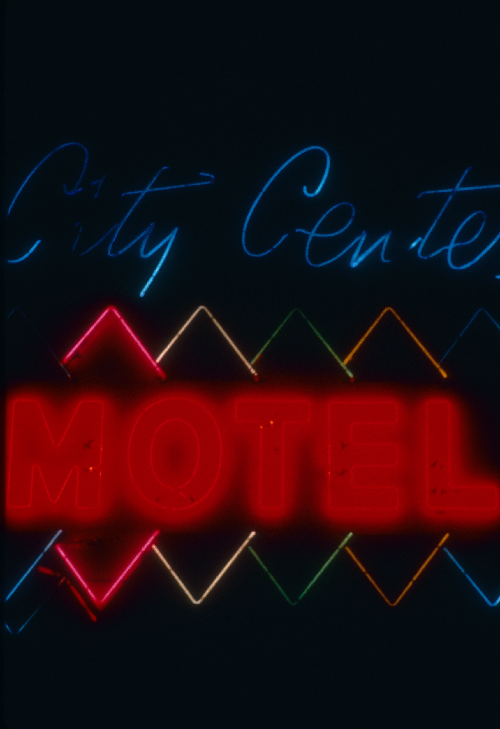 Slide of the neon sign for the City Center Motel at night, Reno, Nevada, 1986