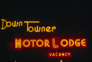Slide of the neon sign for the Down Towner Motor Lodge at night, Reno, Nevada, 1986
