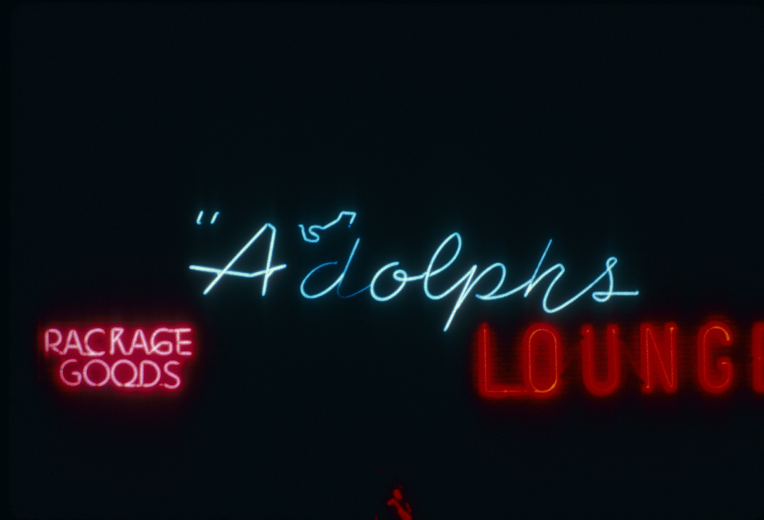 Slide of the neon sign for Adolph's Lounge, Sparks, Nevada, 1986