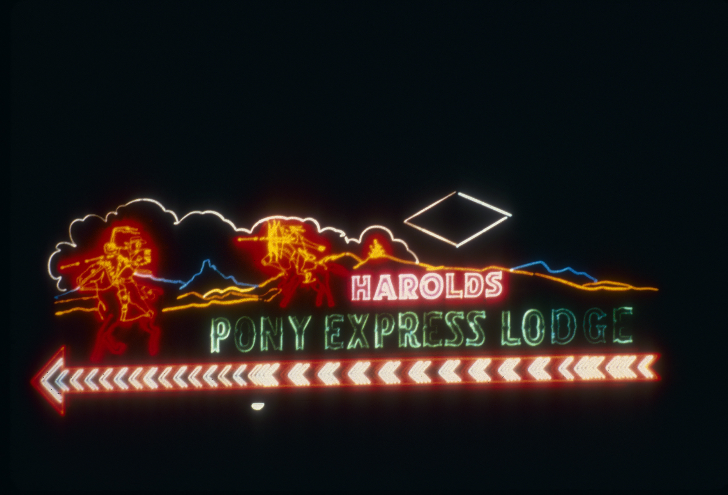 Slide of the neon sign for Harold's Pony Express Lodge, Sparks, Nevada, 1986
