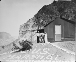 Film transparency of United States Marshal Claude Williams and his family in front of his office, Nevada, April 18, 1931