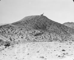 Film transparency of a hill being leveled for a reservoir, Boulder City, Nevada, March 13, 1931