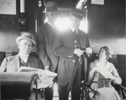Photograph of passengers inside the coach on the first train into Boulder City, Nevada, circa 1931