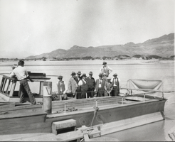 Photograph of a group of men in a boat on the Colorado River, circa 1931