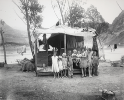 Photograph of children standing in front of a tent in Williamsville, Nevada, circa 1931