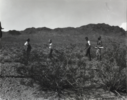 Photograph of men surveying land, Hoover Dam site, March 13, 1931