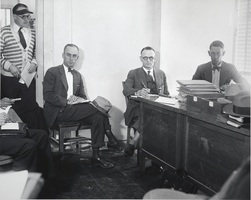 Photograph of men in an office building, Boulder City, Nevada, March 13, 1931