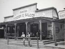 Photograph of two women standing in front of the Frontier Museum and Saloon at Last Frontier Village, Las Vegas, circa 1950s
