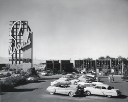 Photograph of the parking lot and front exterior of the Sands Hotel, including its marquee, Las Vegas, circa 1950s