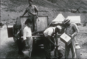 Film transparency of men distributing water in Boulder City, Nevada, May 13, 1931