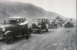 Slide of a U.S. Marshal and cars at a checkpoint in Boulder City, Nevada, circa early 1930s
