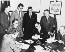 Film transparency of people signing contracts from the Bureau of Reclamation, January 4, 1960