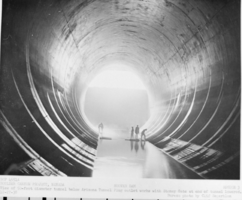 Film transparency of people standing in tunnel, Hoover Dam, December 27, 1938
