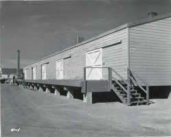 Photograph of a warehouse at Nellis Air Force Base, Nevada, circa 1950s