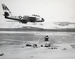 Photograph of an F-86 fighter aircraft at Nellis Air Force Base near Indian Springs, Nevada, circa mid 1950s