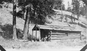 Film transparency of a log cabin at Mount Charleston, Nevada, circa early 1900s