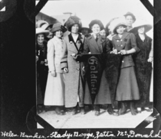 Film transparency of women holding a pennant for Goldfield, Nevada, circa early 1900s