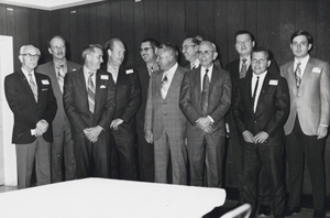 Photograph of men in a row, circa 1950s to 1970s