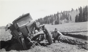 Photograph of a truck in the mud, circa early 1900s