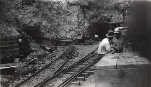 Photograph of men near railroad tracks, circa early 1900s