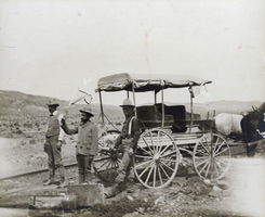Photograph of railroad surveyors next to wagon, circa 1890s-1910