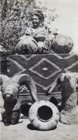 Photograph of Helen J. Stewart with her basket collection, circa 1910s