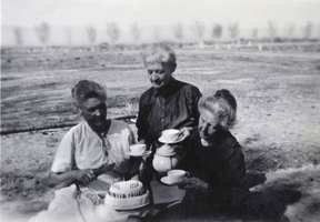 Photograph of Helen J. Stewart and two others outdoors, circa early 1900s