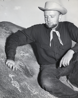 Photograph of Bill Belknap and petroglyphs, circa 1948-1950