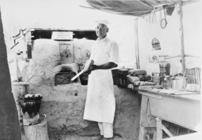 Film transparency of Sergeant Clyatt, in his bake shop at the landing on the Arizona River near Ragtown near Boulder City, Nevada, circa 1930s