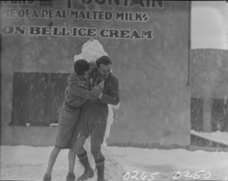 Film transparency of a couple in the snow, Las Vegas, 1930-1931