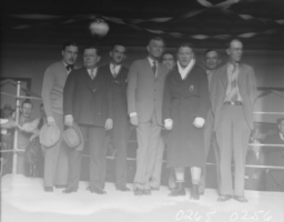 Film transparency of Ace Hudkins posing with men, Las Vegas, 1929