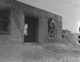 Film transparency of a construction worker renovating the Las Vegas fort, Las Vegas, Nevada, 1930