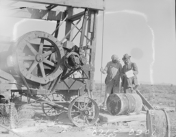 Film transparency of two unidentified men drilling for oil in the Las Vegas valley, Nevada, circa 1930-1932