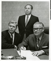 Photograph of Stuart Mason, Morry Mason, and Fred Bennioger meeting to sign a contract for the International Hotel, location unknown, circa 1969