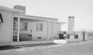 Photograph of Mayme Stocker in front of the Stocker home Las Vegas, Nevada, circa 1930's-1950's
