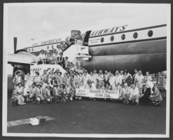 Photograph of people in front of a Pan American Airways plane, unknown location, circa 1952