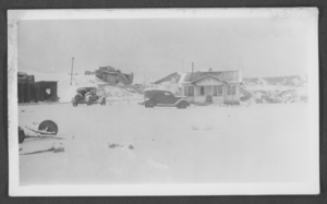 Photograph of snow or sand covering a house and mining building, Moapa, Nevada, circa 1930s-1940s