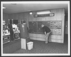 Photograph of post office boxes and slot machines inside the United States Post Office, Laughlin, Nevada, circa 1970s