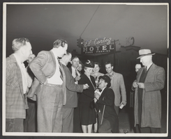 Photograph of people watching a street entertainer outside of the El Cortez Hotel, Las Vegas, Nevada, circa 1945
