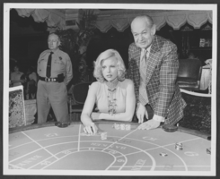 Photograph of gamblers at a baccarat table in the Aladdin Hotel, Las Vegas, Nevada, circa early 1970s