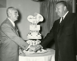 Photograph of Wilbur Clark and Bill Radkovich at Clark's birthday party, Desert Inn, Las Vegas, Nevada, December 27, 1956