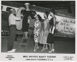 Photograph of Miss Universe contestants by a Desert Inn private plane, Long Beach, California, 1956