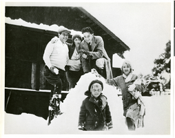 Photograph of Wilbur Clark with a group of people posing in the snow, Springfield, Illinois, circa 1923-1930