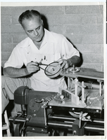 Photograph of Wilbur Clark working on a scale model of a roulette table, Las Vegas, Nevada, circa 1944-1950s