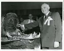 Photograph of Wilbur Clark with an ice sculpture of himself, Desert Inn, Las Vegas, April 1951