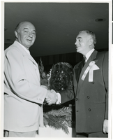 Photograph of Joe Bock and Wilbur Clark at a party celebrating the first anniversary of the Desert Inn, Las Vegas, Nevada, April 1951
