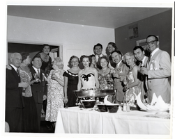 Photograph of Liberace, Tommy and Helen McGinty and guests at the Desert Inn's first anniversary party, Desert Inn, Las Vegas, Nevada, April 1951