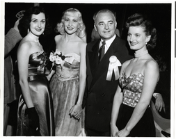 Photograph of Wilbur Clark and three unidentified women at the Desert Inn's first anniversary party, Las Vegas, Nevada, April 1951